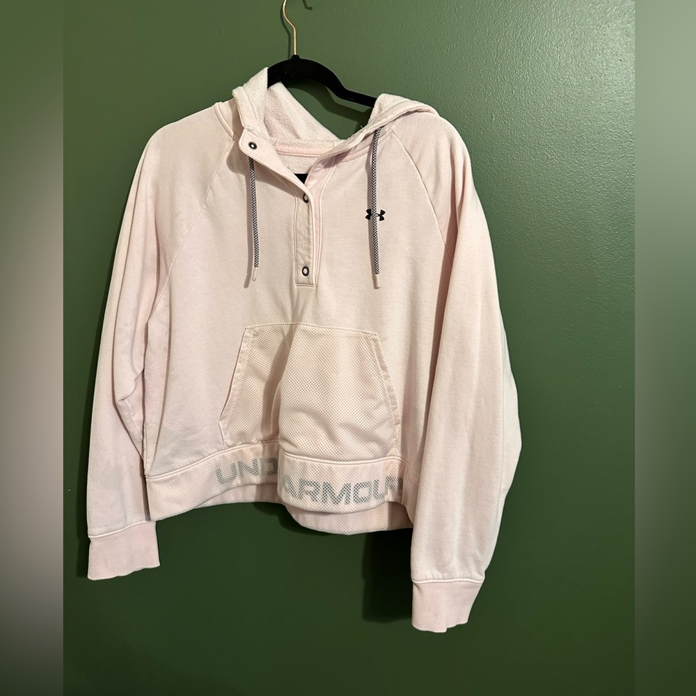 This is a light pink, hooded sweatshirt.